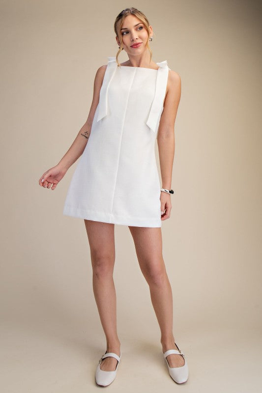 THE KYRA BOW MINI DRESS (WHITE) AVAILABLE OCT 5,2026