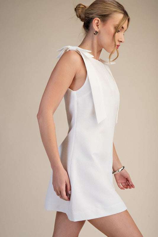 THE KYRA BOW MINI DRESS (WHITE) AVAILABLE OCT 5,2026