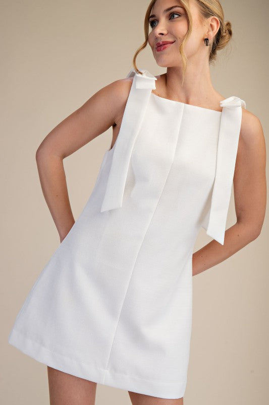 THE KYRA BOW MINI DRESS (WHITE) AVAILABLE OCT 5,2026